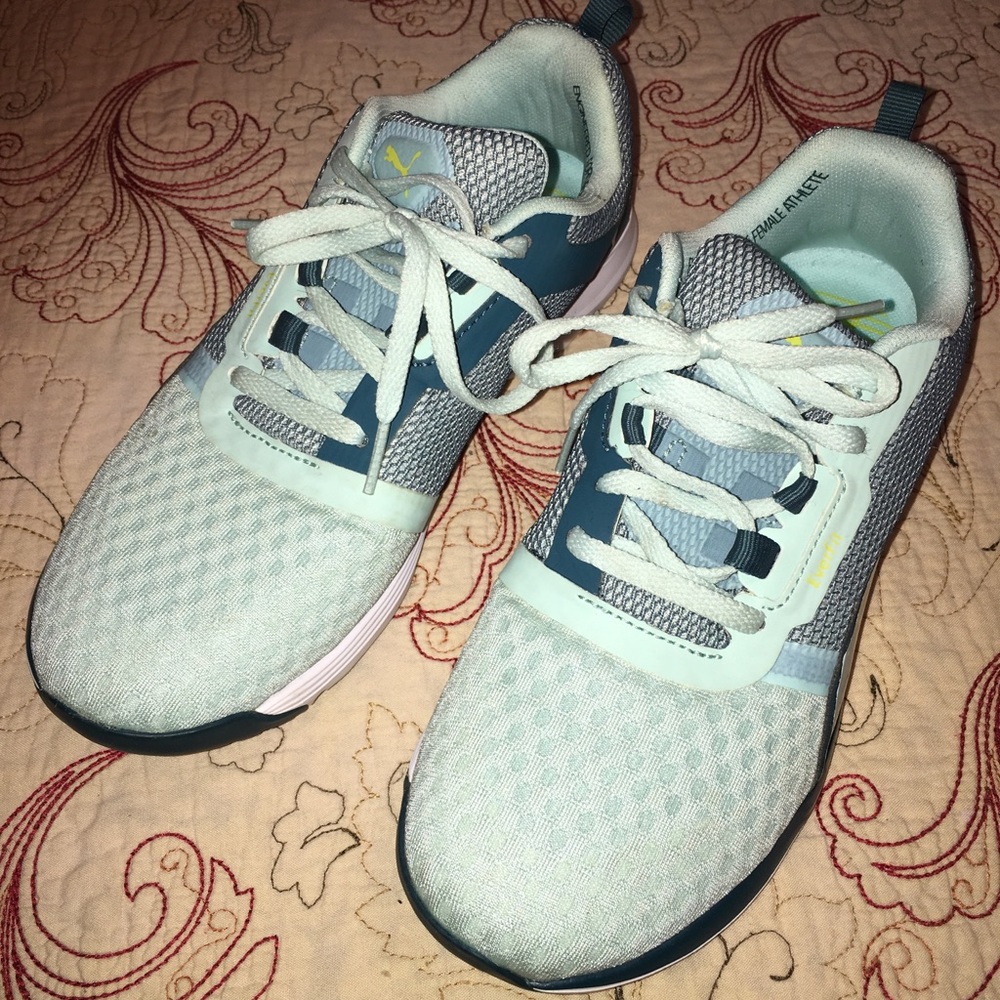 Puma sneakers size 8, light teal in color.